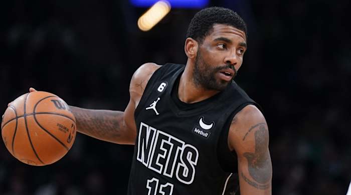 Nets guard Kyrie Irving dribbles the ball
